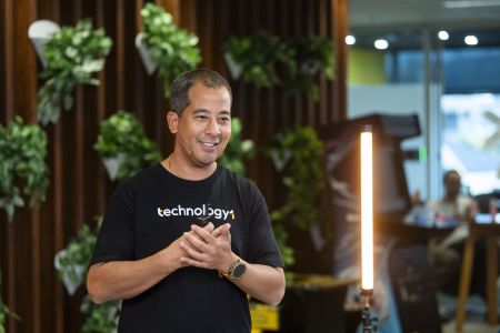 TechnologyOne CEO Ed Chung presenting inside HQ office